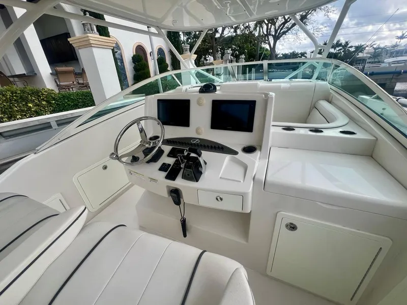 Slide: The Image of 2016 Jupiter 34 LX boat cockpit with modern controls and dual screens. - 10