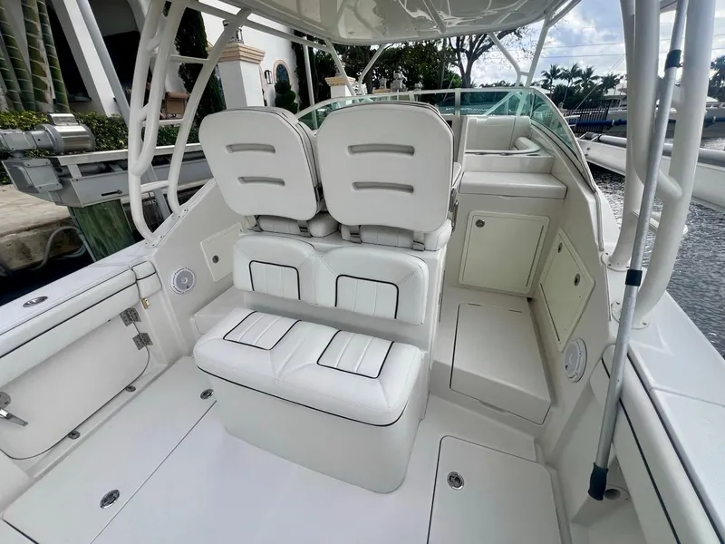 Slide: The Image of 2016 Jupiter 34 LX boat interior with white seating and helm station. - 14