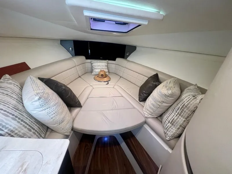 Slide: The Image of Luxurious interior of 2016 Jupiter 34 LX boat with plush seating and decorative pillows. - 19