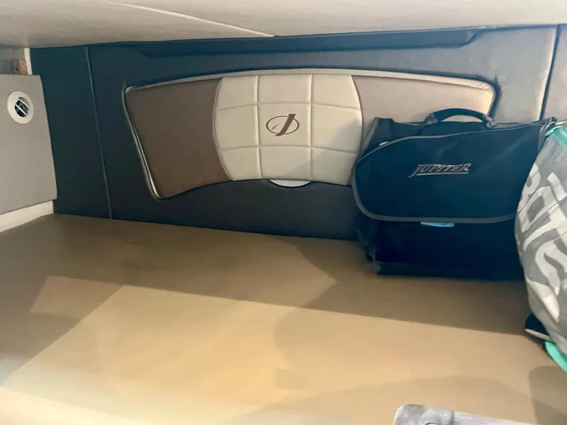 Slide: The Image of 2016 Jupiter 34 LX cabin interior with branded bag and cushioned wall panel. - 21