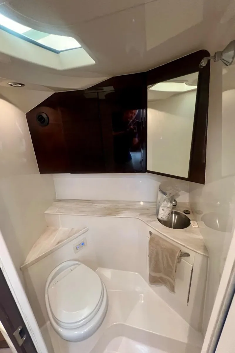 Slide: The Image of 2016 Jupiter 34 LX boat bathroom with modern fixtures and skylight. - 23