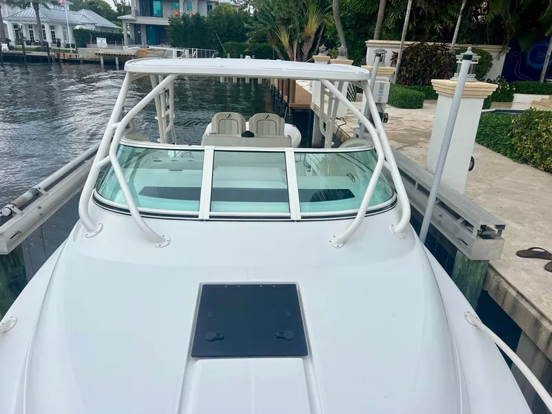 Slide: The Image of 2016 Jupiter 34 LX boat docked by waterfront homes. - 4