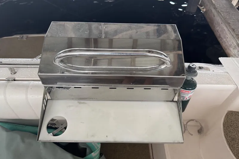 Slide: The Image of Stainless steel grill on 2005 Regal 3560 Commodore boat deck, with propane tank attached. - 13