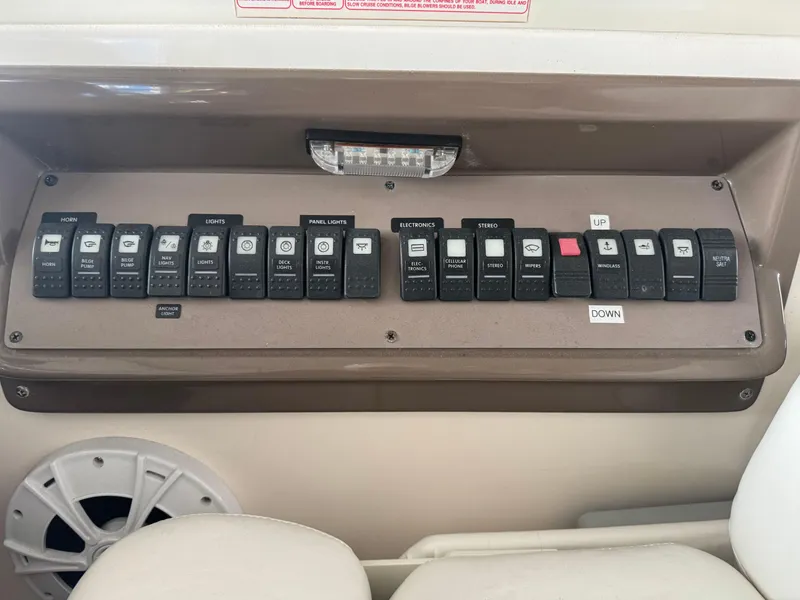 Slide: The Image of Control panel of a 2005 Regal 3560 Commodore boat with labeled switches and speaker. - 17