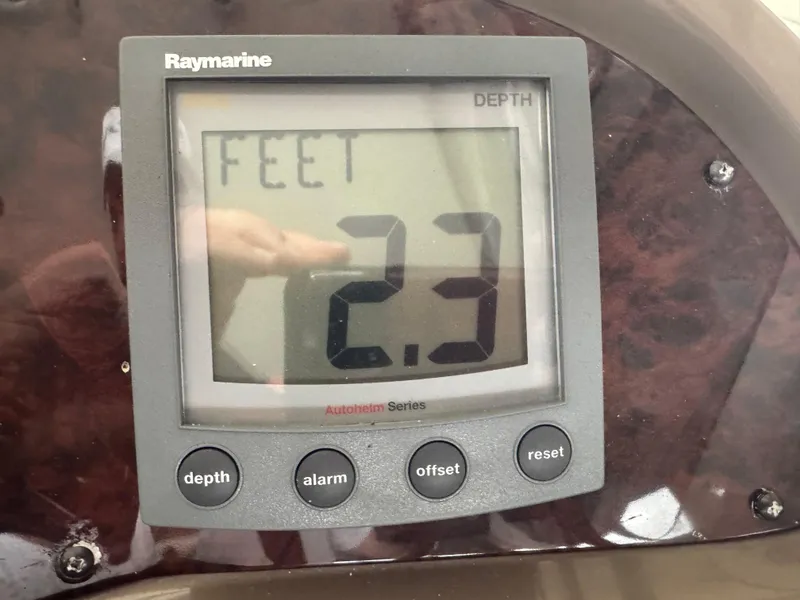 Slide: The Image of Raymarine depth gauge showing 2.3 feet on a 2005 Regal 3560 Commodore. - 19