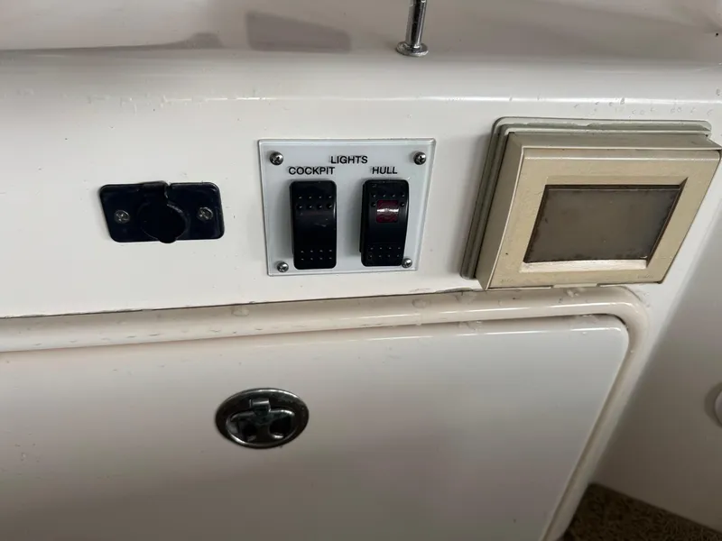Slide: The Image of Control panel of a 2005 Regal 3560 Commodore boat with light switches. - 20