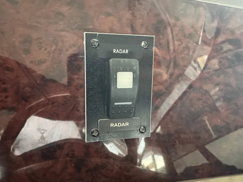 Slide: The Image of Radar switch on 2005 Regal 3560 Commodore boat dashboard. - 21