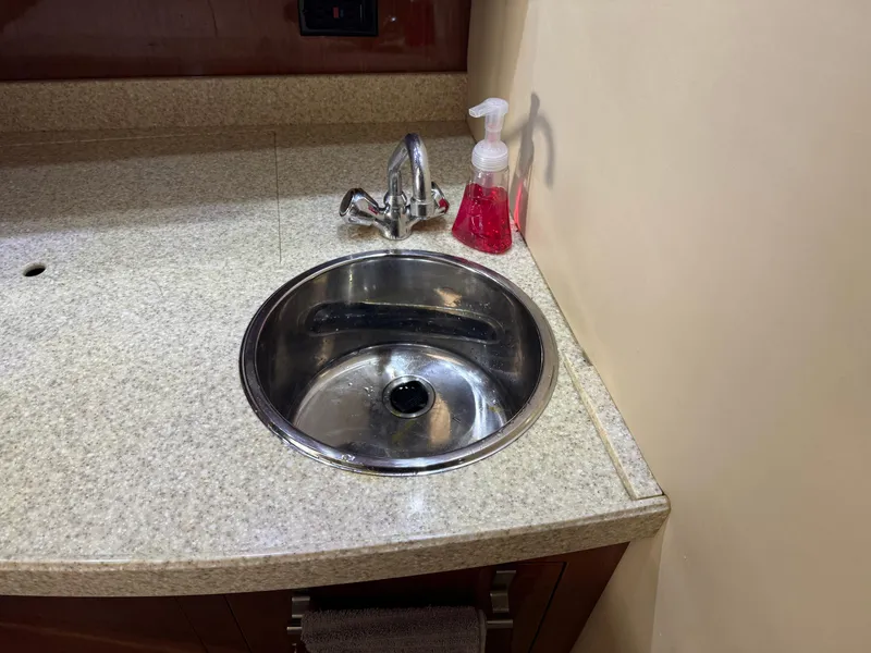 Slide: The Image of 2005 Regal 3560 Commodore sink with granite countertop and soap dispenser. - 30