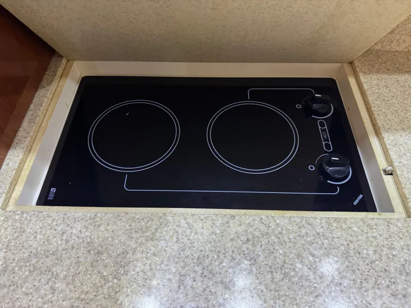 Slide: The Image of Built-in stovetop on 2005 Regal 3560 Commodore yacht kitchen counter. - 34