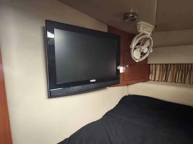 Slide: The Image of Interior of 2005 Regal 3560 Commodore with TV and fan in cabin. - 37