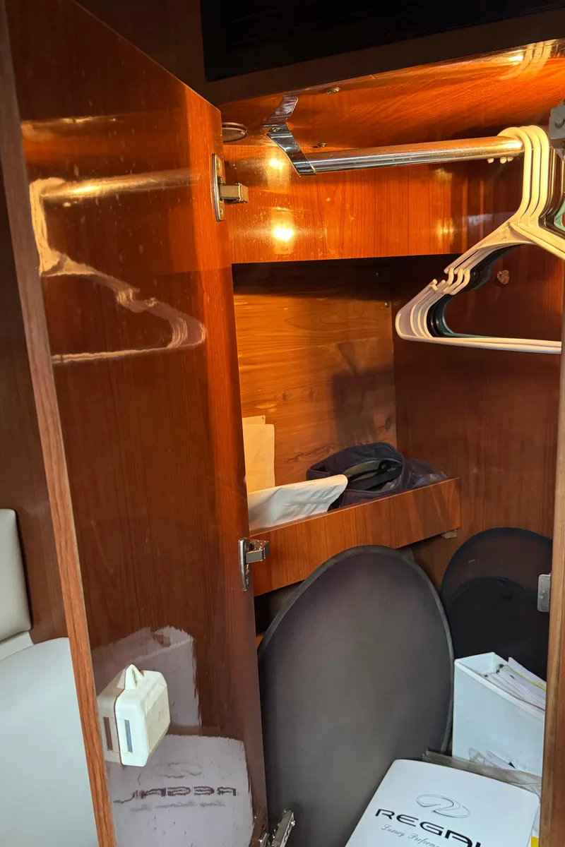 Slide: The Image of 2005 Regal 3560 Commodore closet interior with hangers and storage. - 39