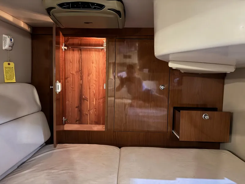 Slide: The Image of Interior of 2005 Regal 3560 Commodore yacht with wooden cabinetry and seating. - 40