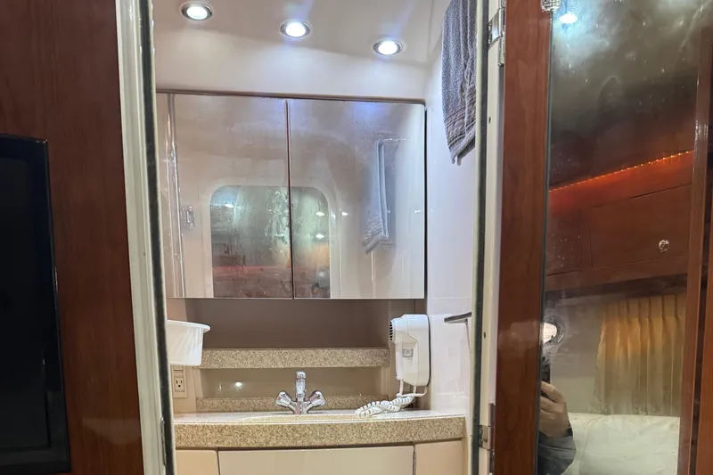 Slide: The Image of Luxurious bathroom interior of 2005 Regal 3560 Commodore yacht with modern fixtures. - 41