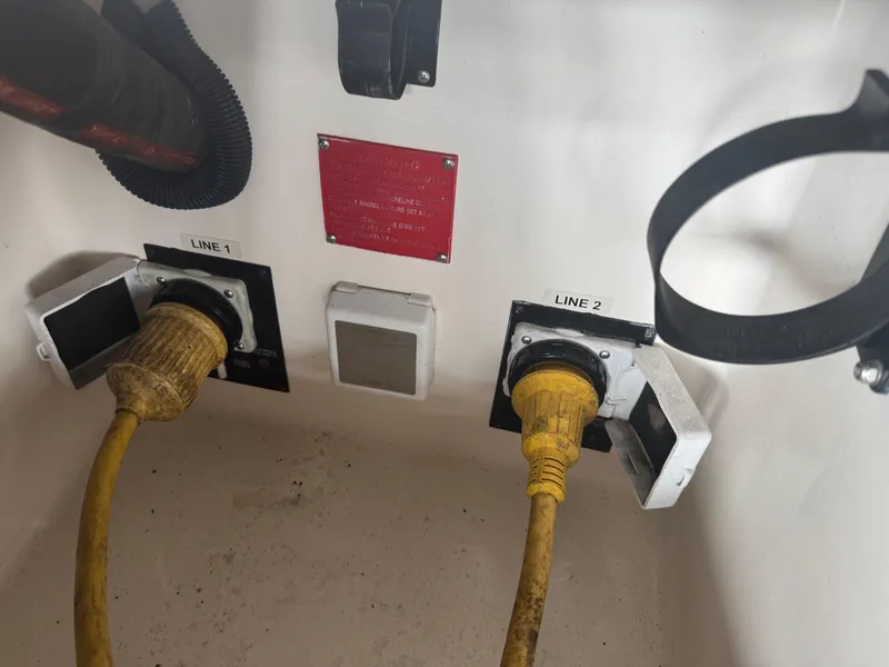Slide: The Image of Power connections on a 2005 Regal 3560 Commodore boat, labeled Line 1 and Line 2. - 43