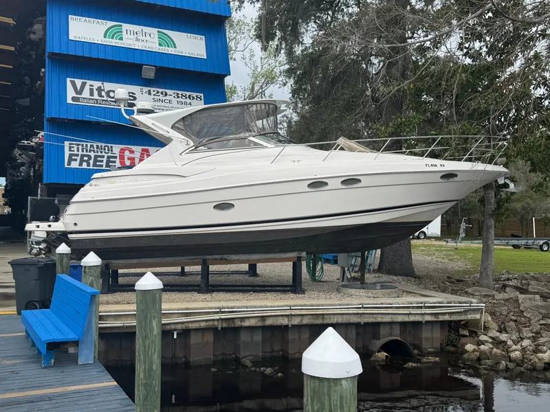 Slide: The Image of 2005 Regal 3560 Commodore yacht cruising on a calm lake. - 6
