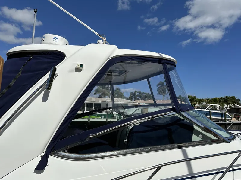 Slide: The Image of 2006 Formula 40 PC yacht with clear canopy under a blue sky. - 11