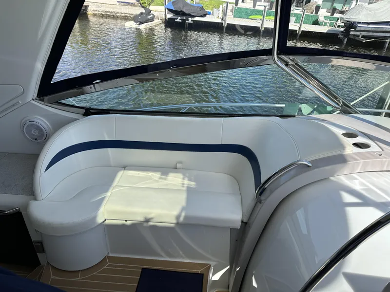 Slide: The Image of 2006 Formula 40 PC yacht interior with white seating and waterfront view. - 15