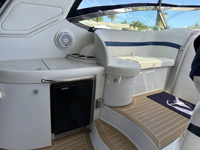 Slide: The Image of 2006 Formula 40 PC yacht interior with seating and mini fridge. - 16