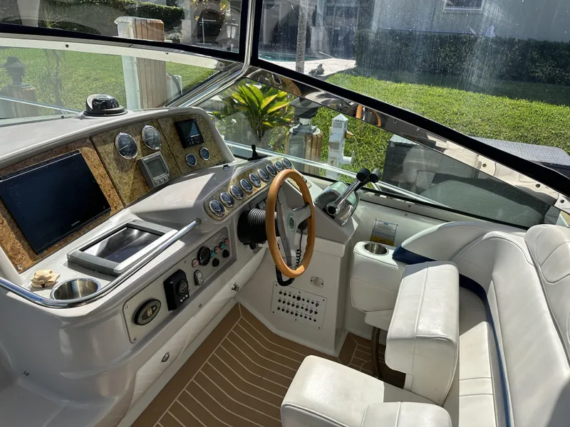 Slide: The Image of 2006 Formula 40 PC boat cockpit with modern controls and wooden steering wheel. - 17