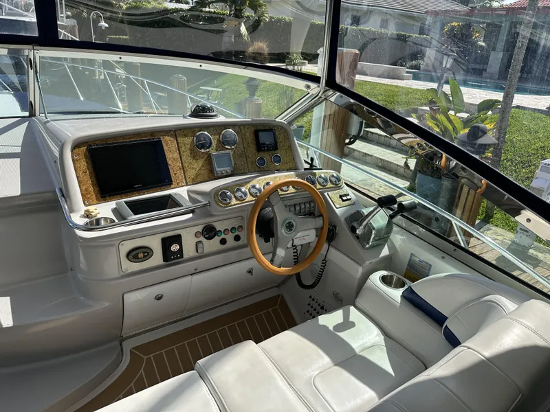 Slide: The Image of 2006 Formula 40 PC yacht cockpit with modern controls and wooden steering wheel. - 18