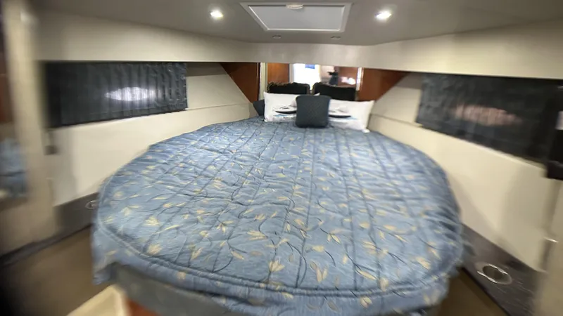 Slide: The Image of Luxurious cabin interior of a 2006 Formula 40 PC yacht with a spacious bed. - 22