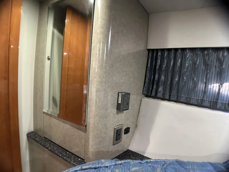 Slide: The Image of Interior of a 2006 Formula 40 PC yacht cabin with wood accents and modern design. - 23