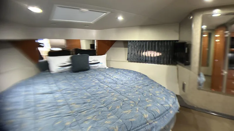 Slide: The Image of Luxurious cabin interior of a 2006 Formula 40 PC yacht with a cozy bed. - 25