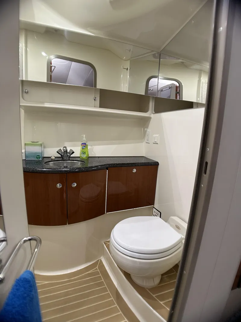 Slide: The Image of 2006 Formula 40 PC yacht bathroom with modern fixtures and wooden cabinetry. - 28