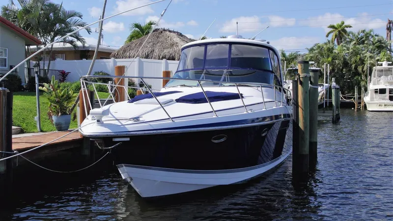 Slide: The Image of 2006 Formula 40 PC yacht docked in a sunny marina setting. - 3