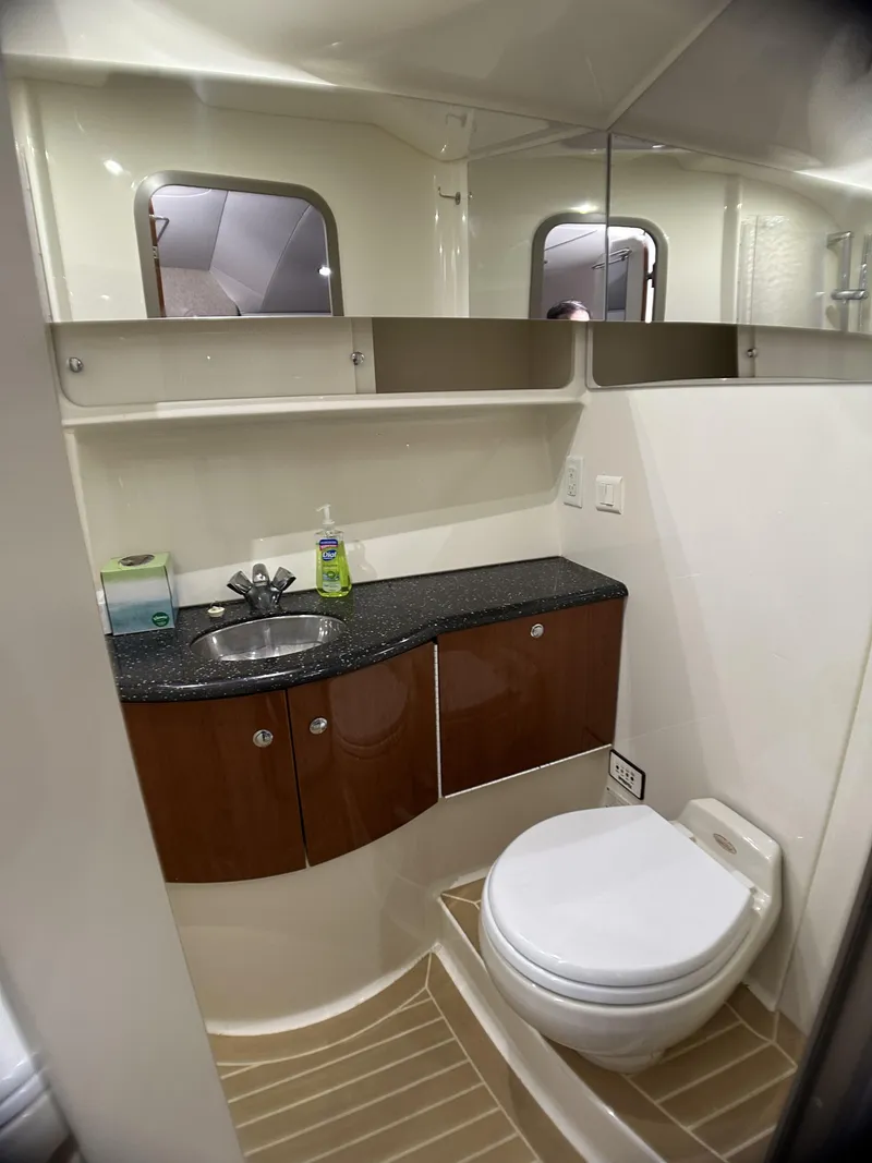 Slide: The Image of 2006 Formula 40 PC yacht bathroom with modern fixtures and wood cabinetry. - 31