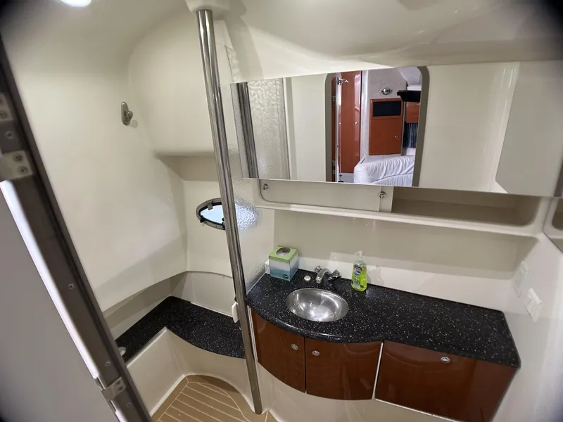 Slide: The Image of 2006 Formula 40 PC yacht bathroom with modern sink, mirror, and storage cabinets. - 33