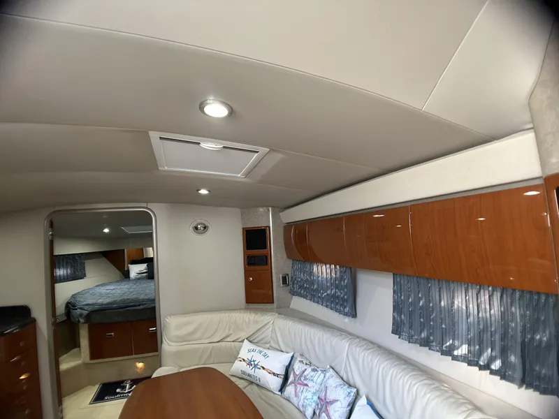 Slide: The Image of Interior of 2006 Formula 40 PC yacht with cozy seating and elegant wood finishes. - 39