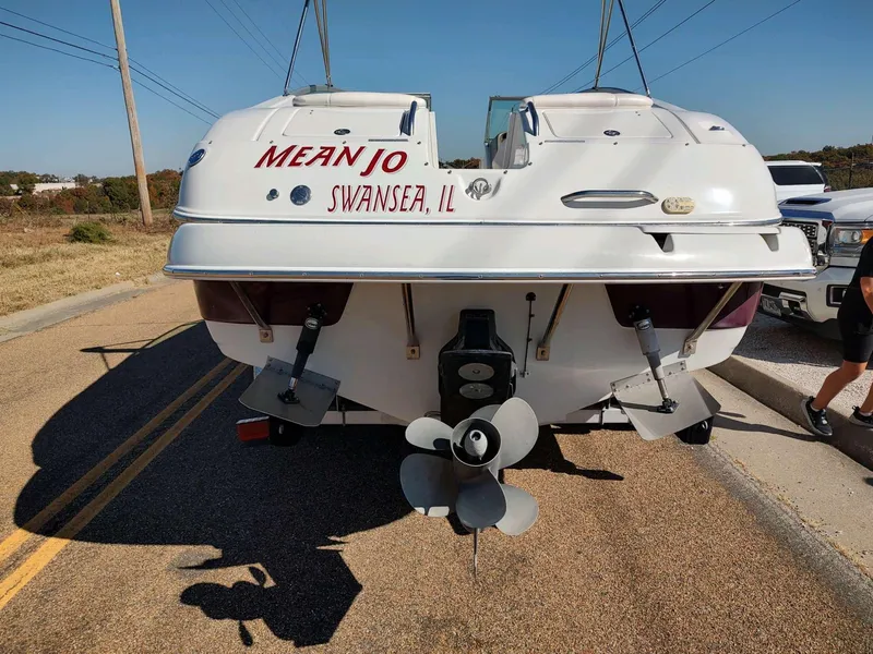Slide: The Image of 2006 Crownline 270 BR boat on trailer, rear view, with dual propellers. - 10