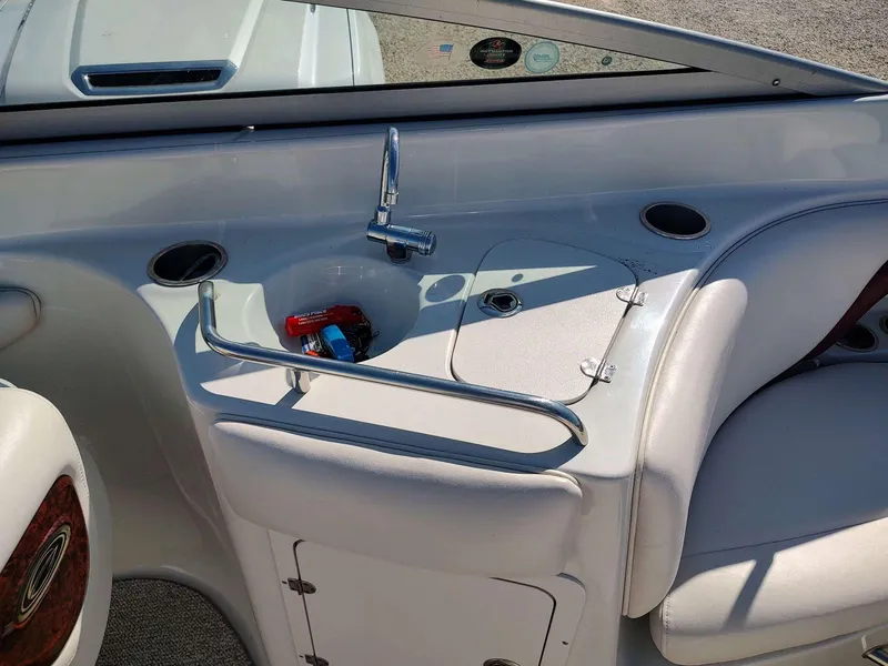 Slide: The Image of Interior of 2006 Crownline 270 BR boat with sink and seating area. - 8