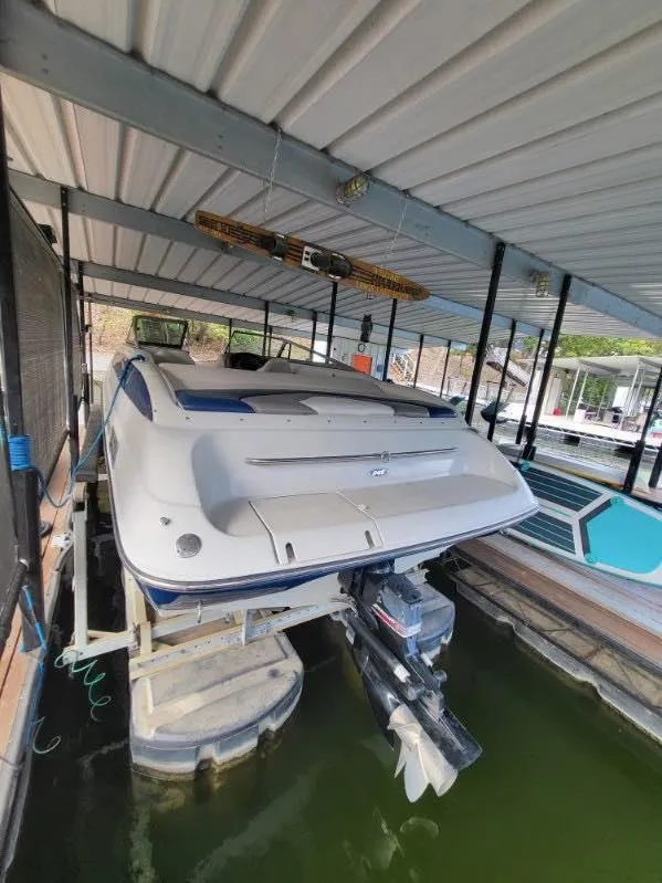 Slide: The Image of 2001 Crownline 248 BR boat docked in covered marina. - 7