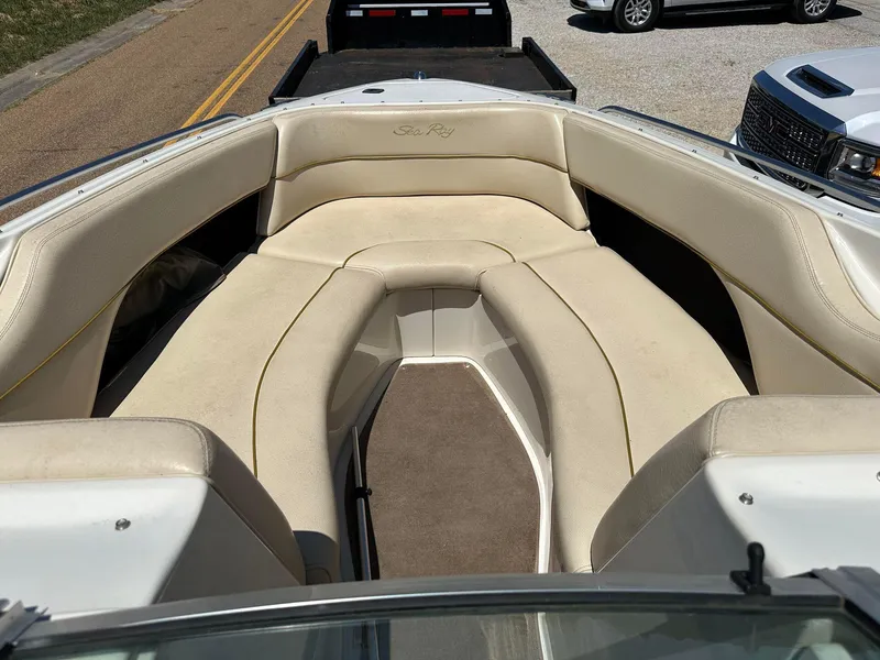Slide: The Image of 2001 Sea Ray 260 Bow Rider with beige seating and spacious bow area. - 3