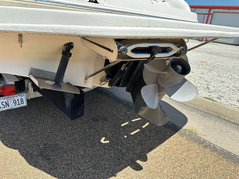 Slide: The Image of 2001 Sea Ray 260 Bow Rider boat stern with propeller and license plate visible. - 4