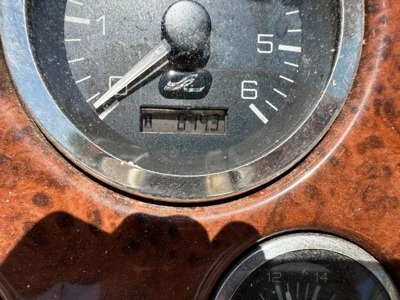 Slide: The Image of Close-up of 2001 Sea Ray 260 Bow Rider dashboard gauge showing 675 hours. - 8