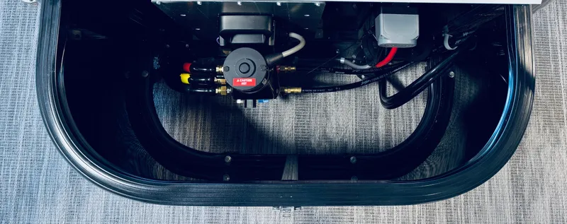 Slide: The Image of 2025 Tahoe Pontoon LTZ Versatile Rear Bench interior wiring and components. - 12