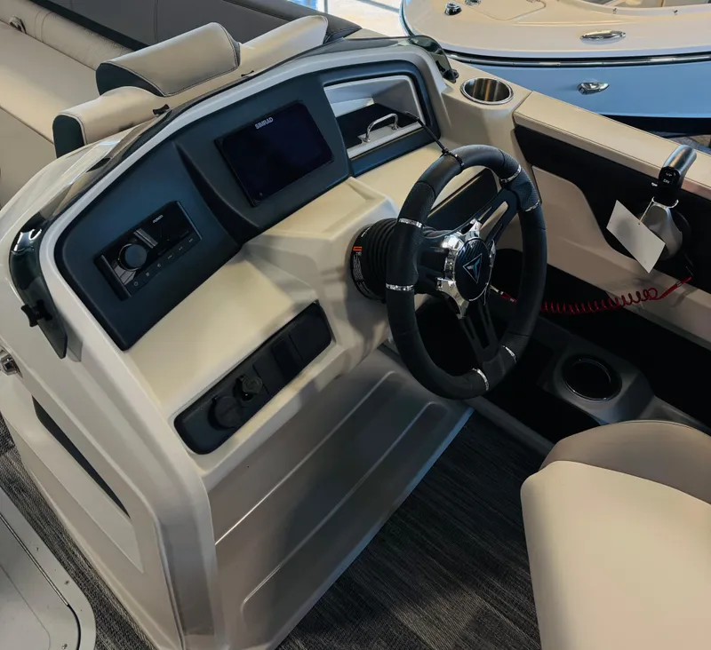 Slide: The Image of 2025 Tahoe Pontoon LTZ Versatile Rear Bench dashboard with steering wheel and controls. - 8