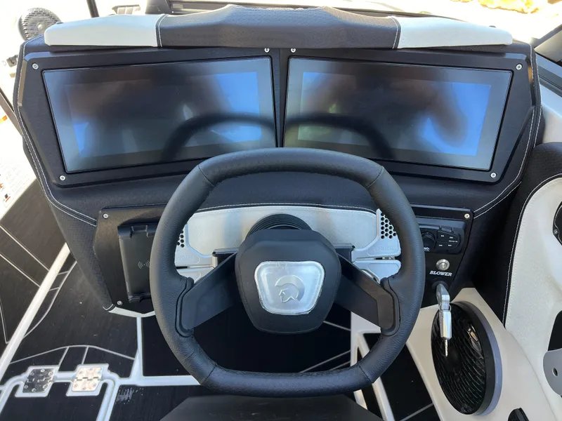 Slide: The Image of 2024 Centurion Fi23 dashboard with dual screens and steering wheel. - 16