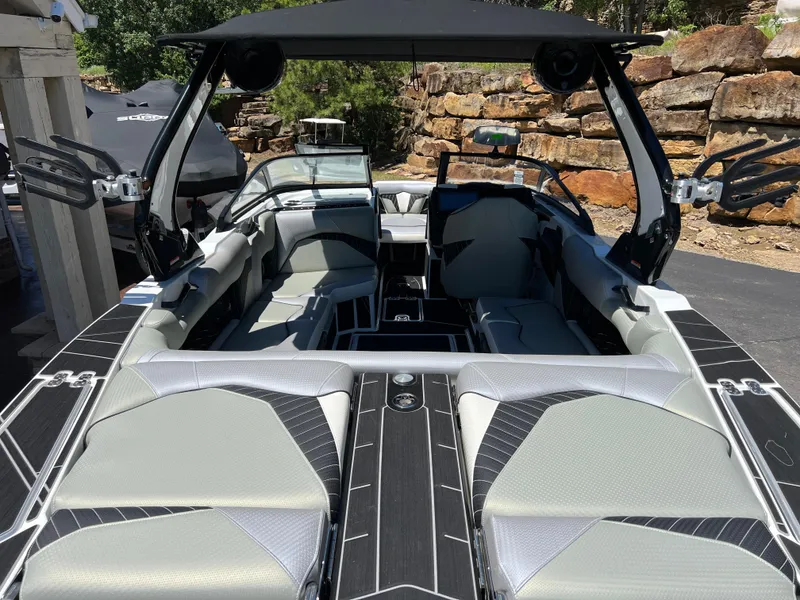 Slide: The Image of 2024 Centurion Fi23 boat interior with sleek seating and modern design. - 17