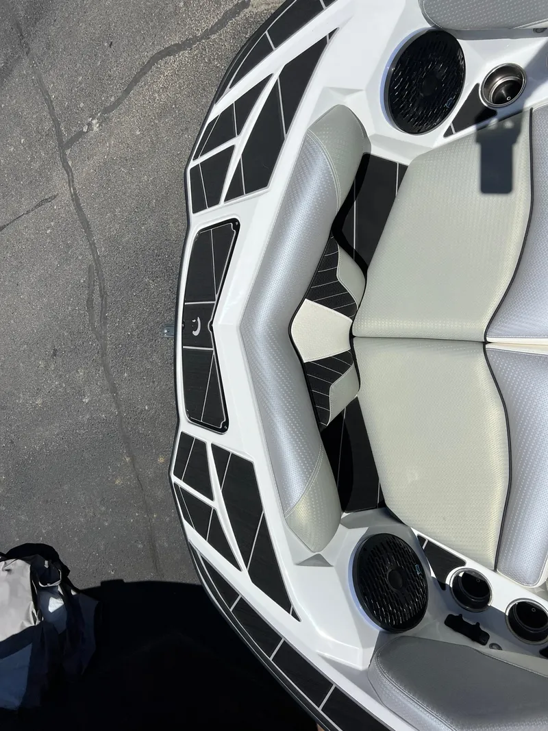 Slide: The Image of 2024 Centurion Fi23 boat interior with modern seating and speaker system. - 26