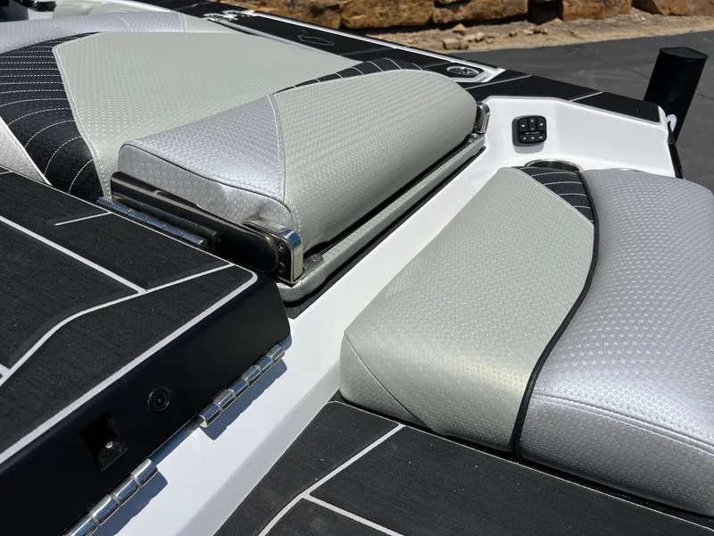 Slide: The Image of 2024 Centurion Fi23 boat interior with sleek, modern upholstery and detailed stitching. - 6