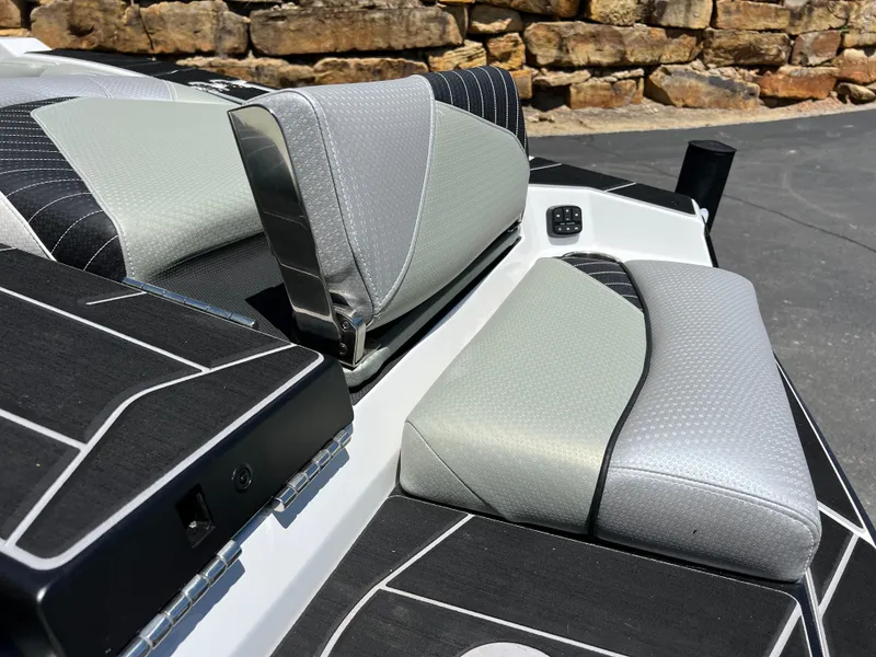 Slide: The Image of 2024 Centurion Fi23 boat interior with sleek gray and black seating design. - 7