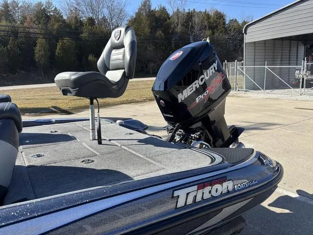 Slide: The Image of 2016 Triton 189 TRX boat with Mercury Pro XS engine, parked outdoors. - 13