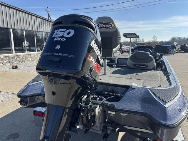 Slide: The Image of 2016 Triton 189 TRX boat with Mercury 150 Pro XS engine, parked outdoors. - 2
