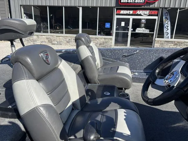 Slide: The Image of 2016 Triton 189 TRX boat interior with gray leather seats and steering wheel. - 6