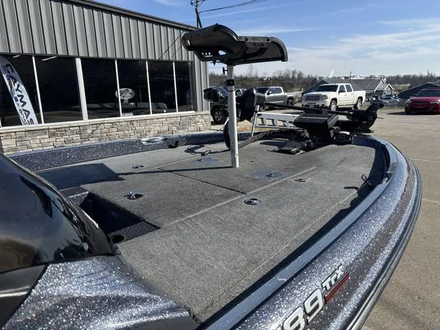 Slide: The Image of 2016 Triton 189 TRX boat with fishing deck, parked outside dealership. - 7