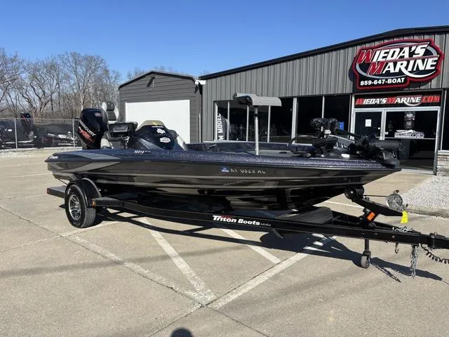 Slide: The Image of 2016 Triton 189 TRX bass boat on trailer at Wida's Marine dealership. - 8
